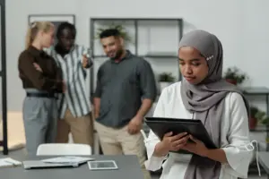 A Muslim woman getting shunned by her coworkers.