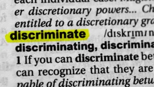A close up definition of the word Discriminate.