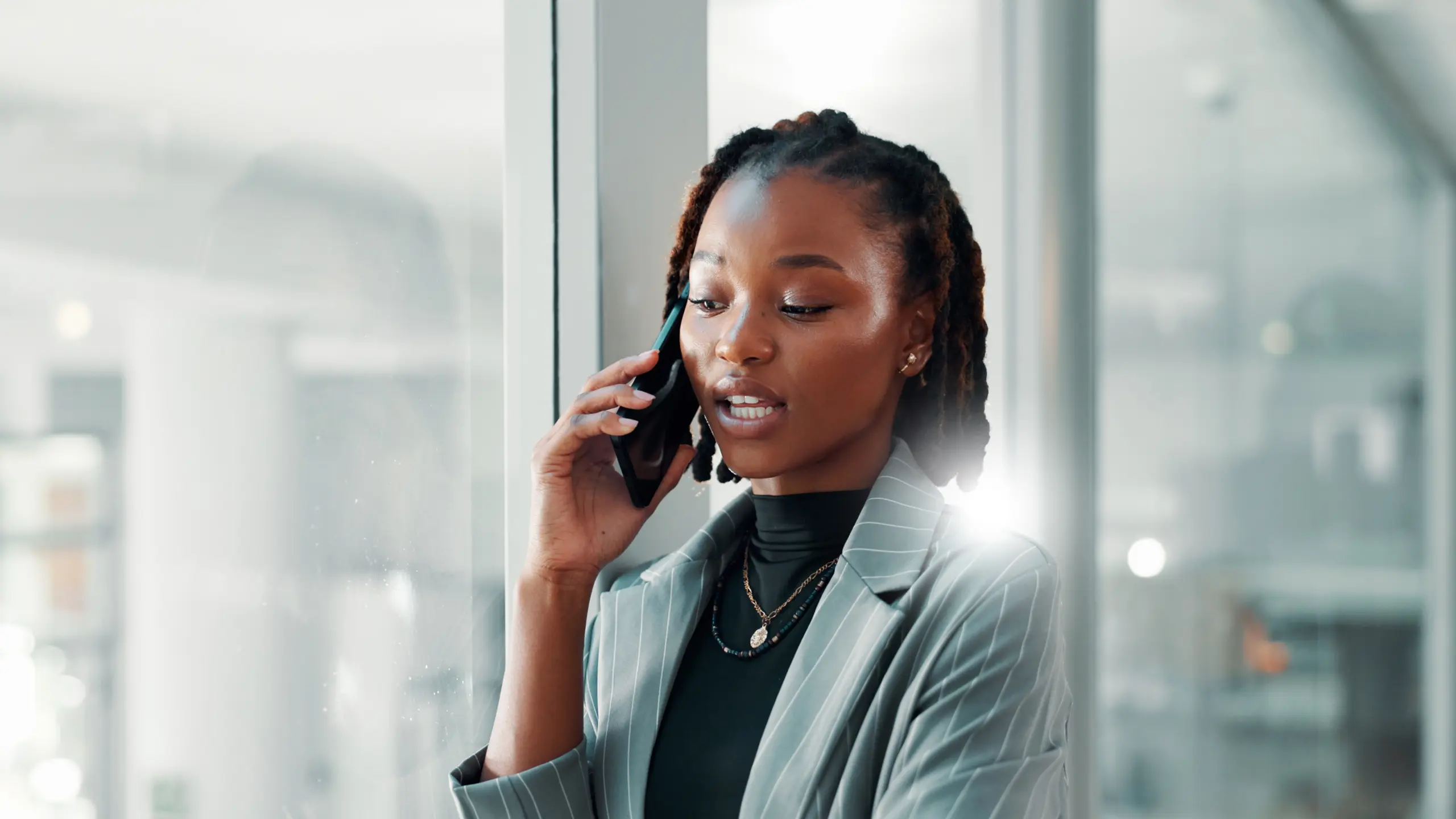 A woman on the phone calling someone.