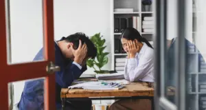 Two employees stressed out a table.