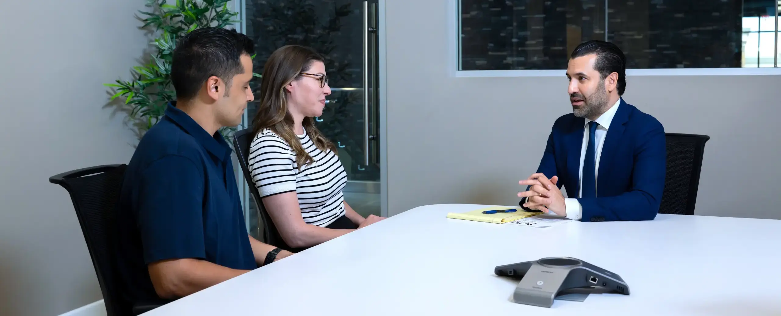 Neama Rahmani talking to a couple about their case.