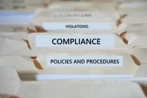 A series of folders, with one labeled as 'Compliance".