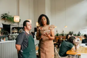 A disabled man getting lectured by his boss.