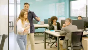 A rude boss telling one of his employees to get out.