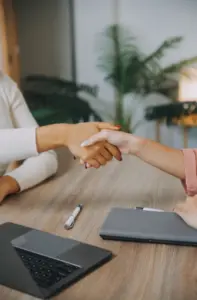 Two people shaking hands.
