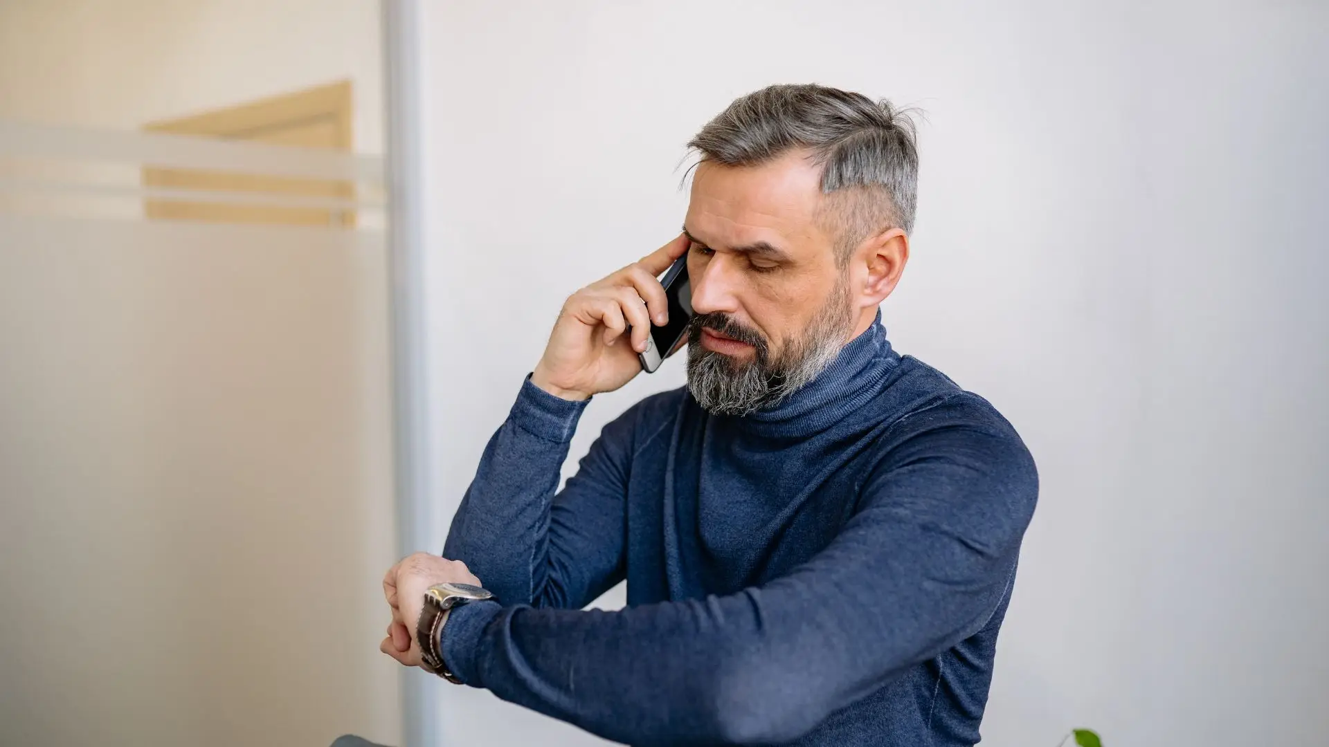 A man calling his lawyer on the phone.