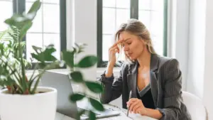 A tired woman at work.