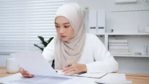 A woman wearing a hijab at work.