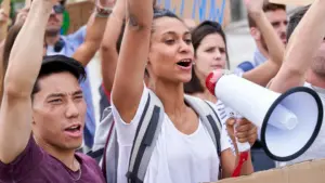 A group of protestors marching and shouting.