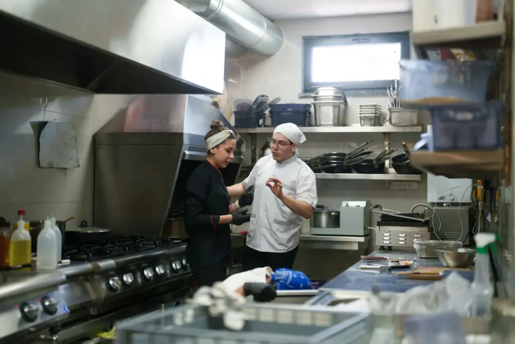A chef shouting at a sous chef.