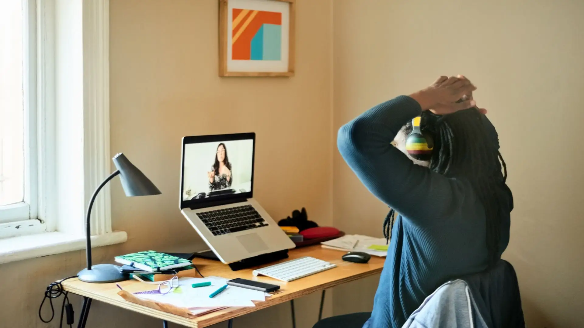 A man getting fired remotely by the company's HR worker.