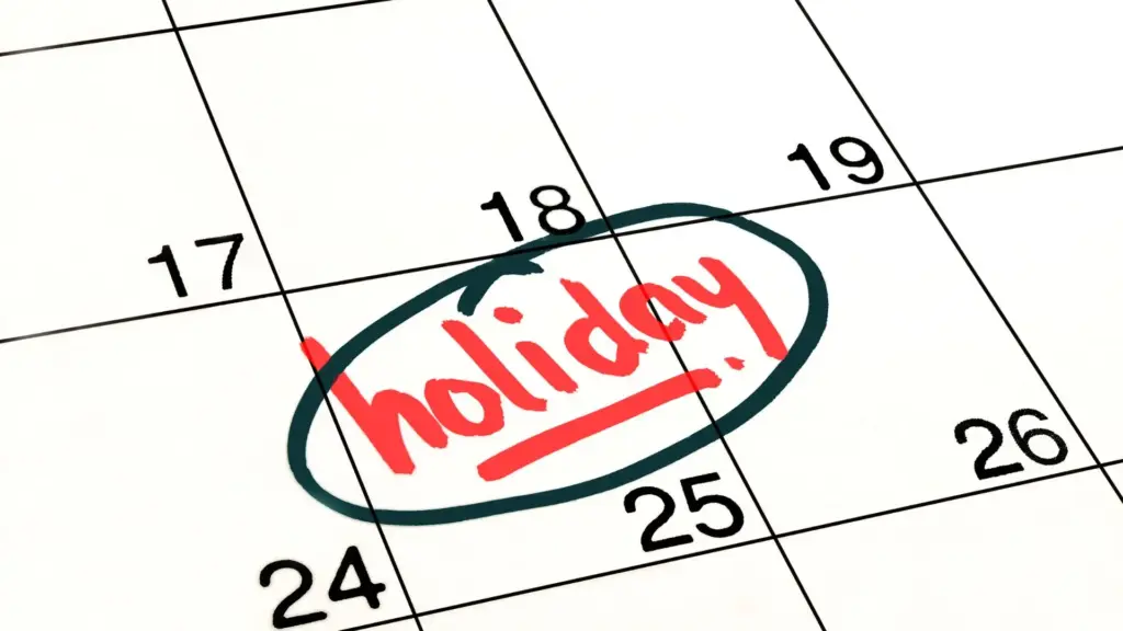 A calendar with a day marked with "holiday". 