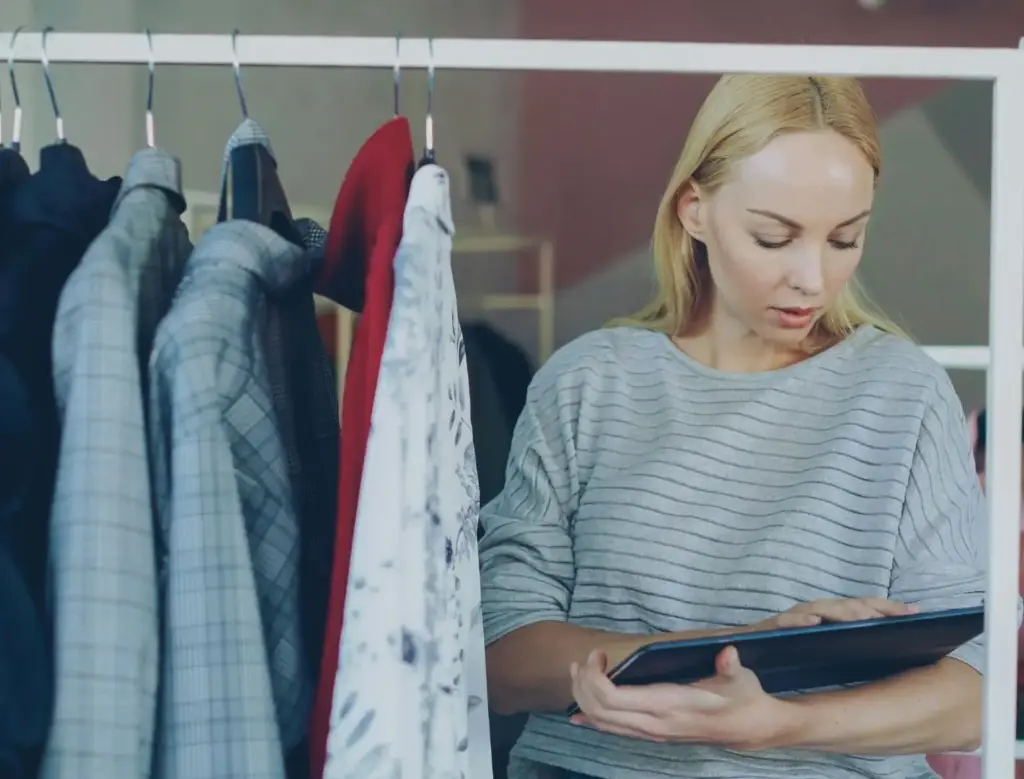 A retail supervisor working on her tablet.
