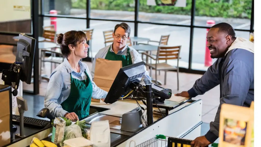 A coffee worker talking to a customer.