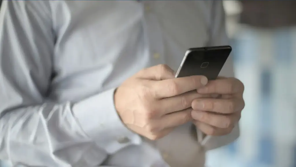 A worker receiving a text from his boss when he is off the clock.