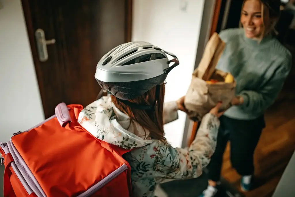 An independent contractor delivering food for someone.