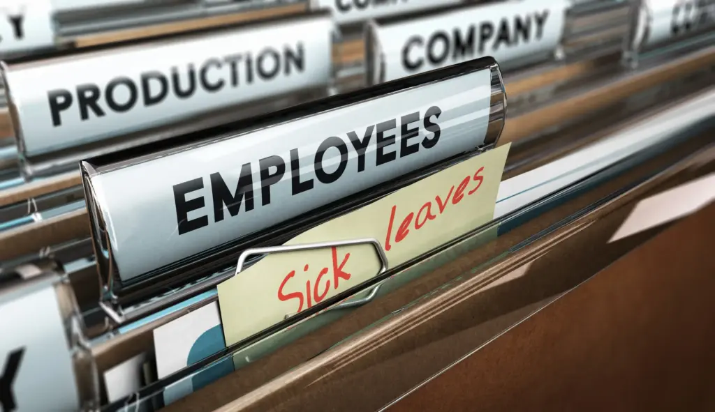 An "employees" folder with a sick leave sticky note on it.