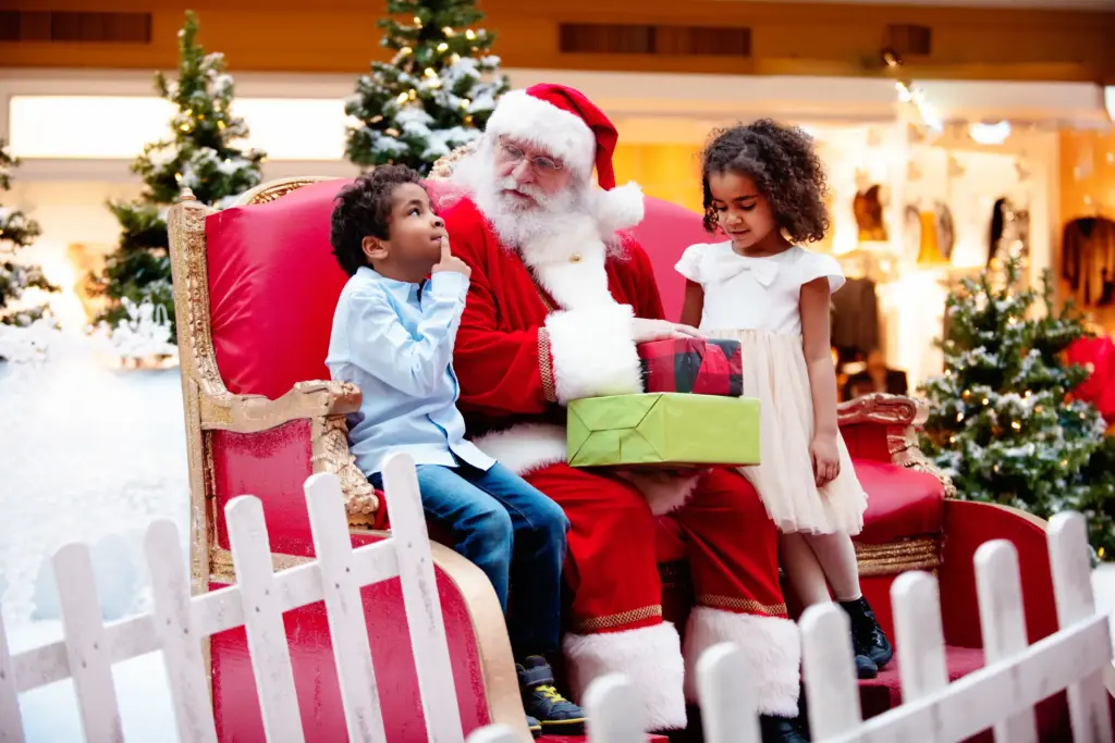 A mall santa talking to kids.
