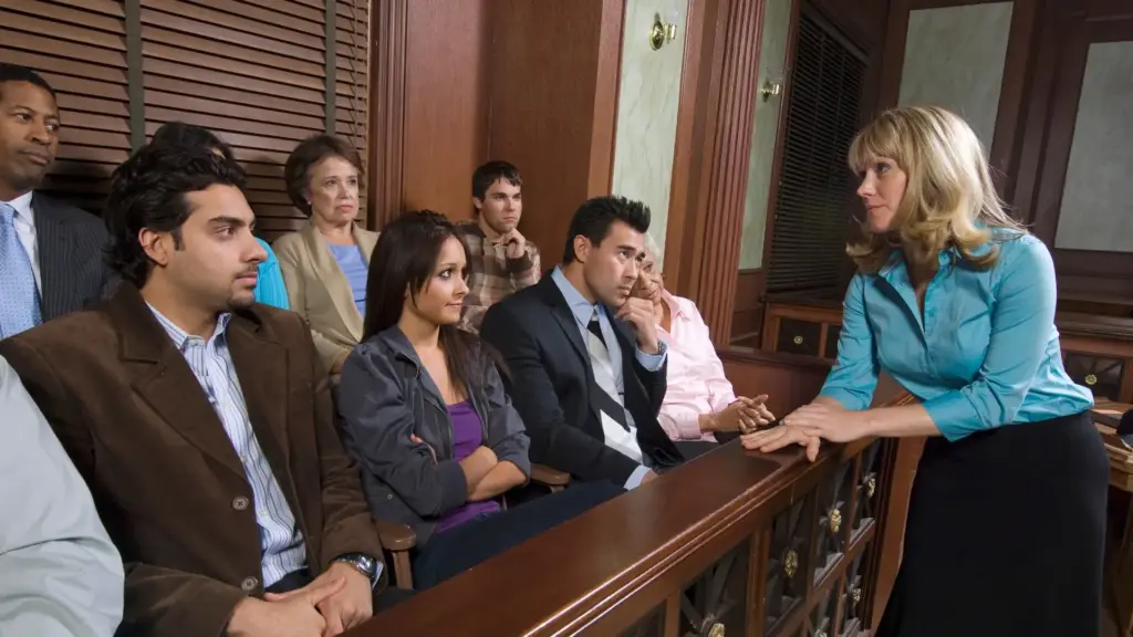 A jury getting instructions from an attorney.