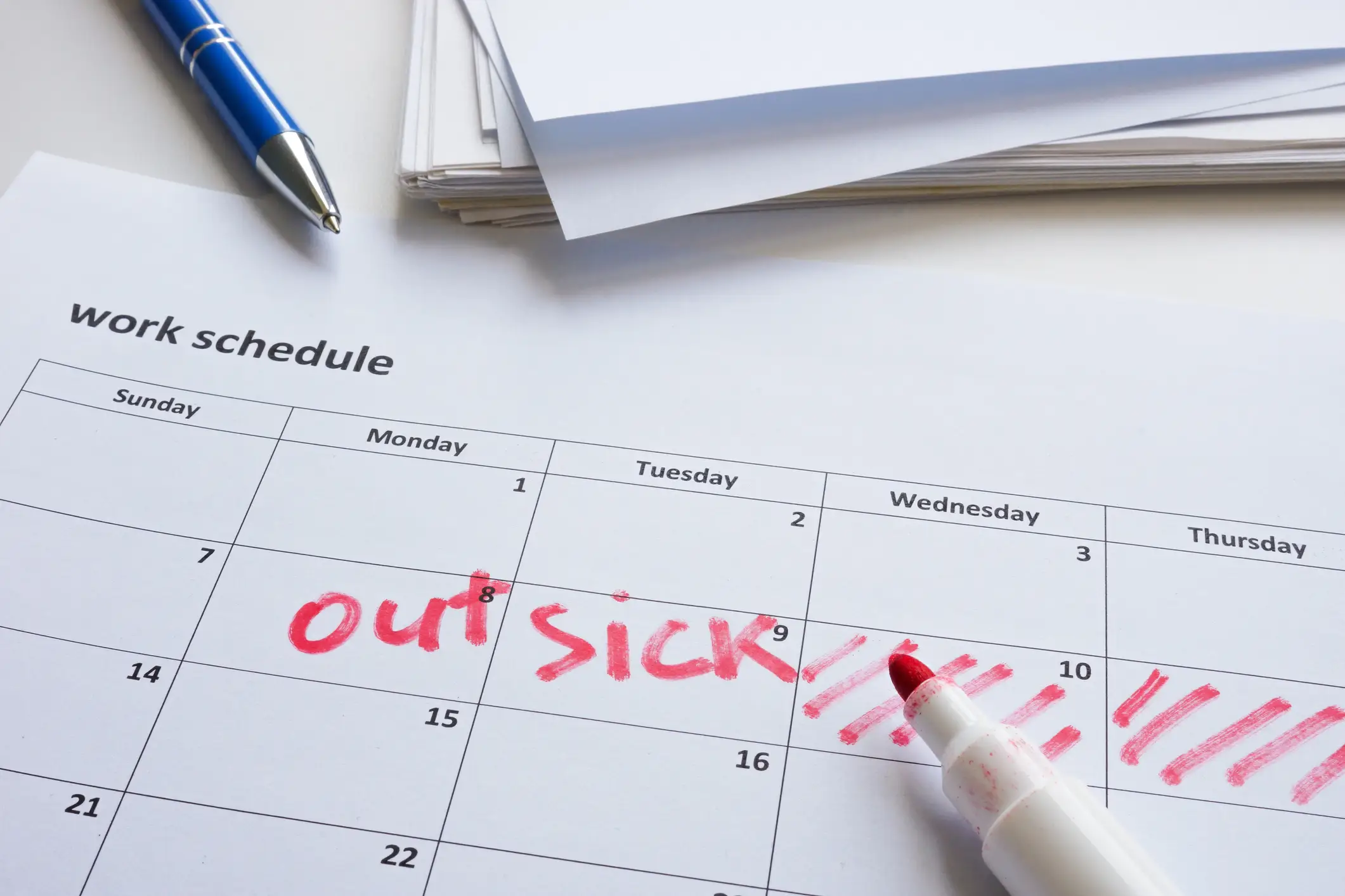 A calendar that marks an entire week out as "out sick".