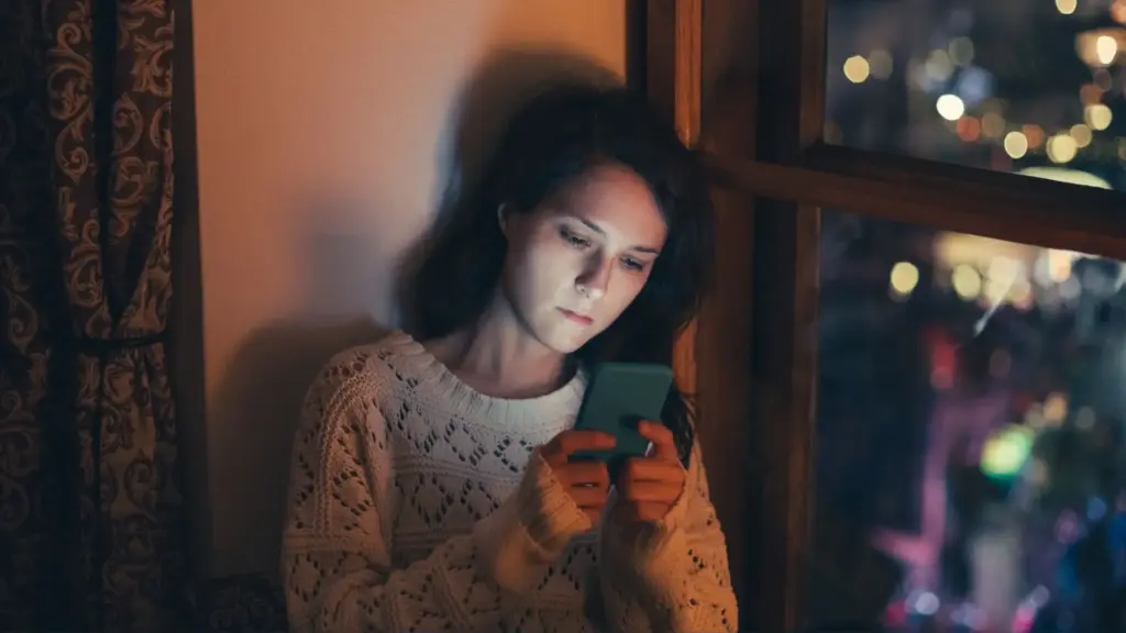 A women receiving texts from her boss when she is off. 
