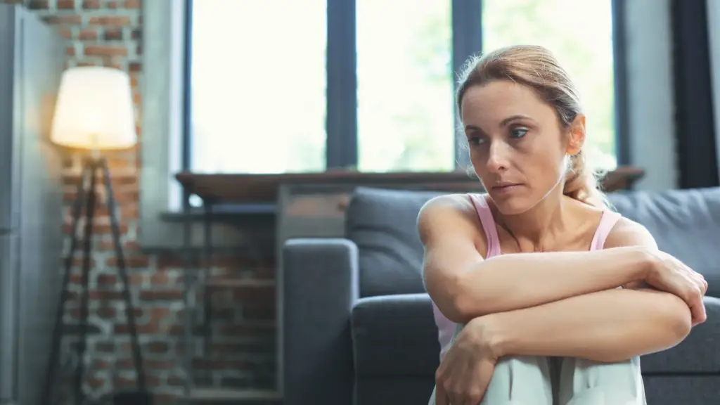 A woman trying to grieve at home, but is struggling. 