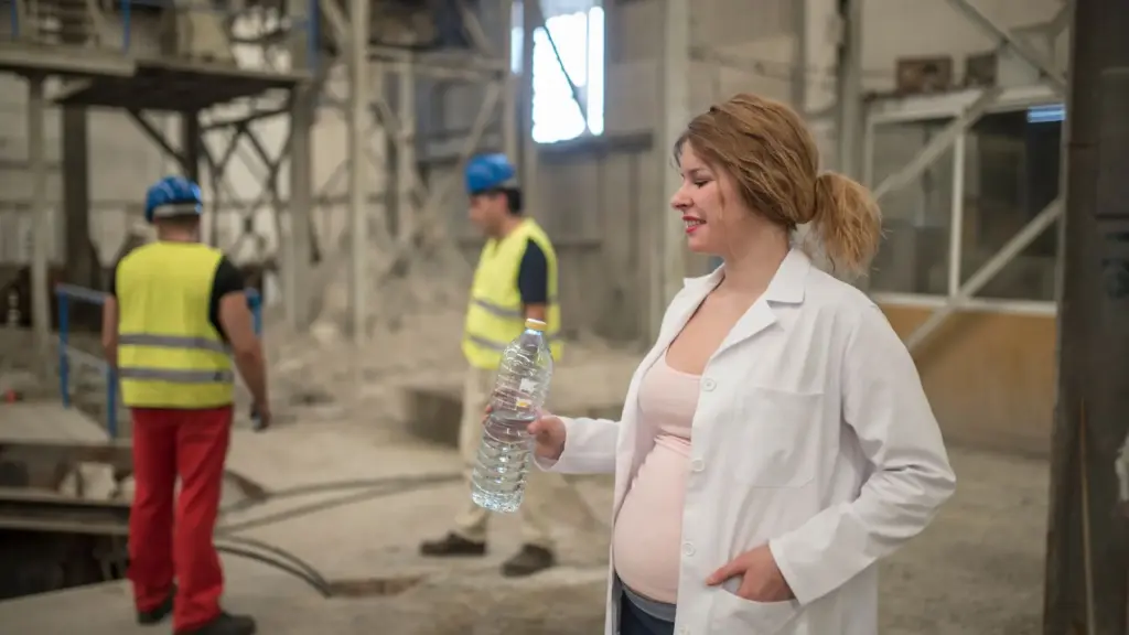 A pregnant worker on a construction site supervising.