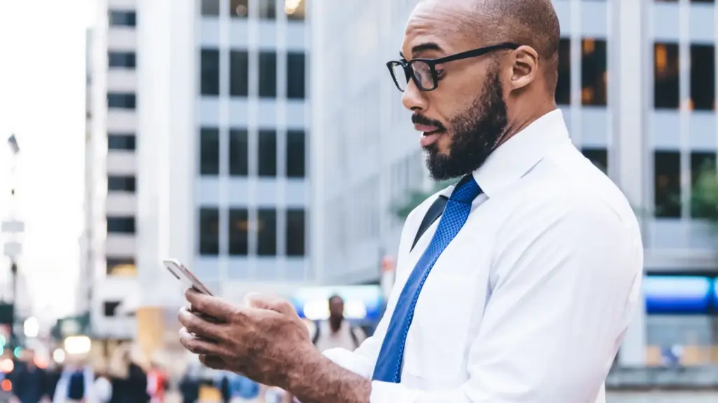 A man getting texts from his boss after he clocked out. 