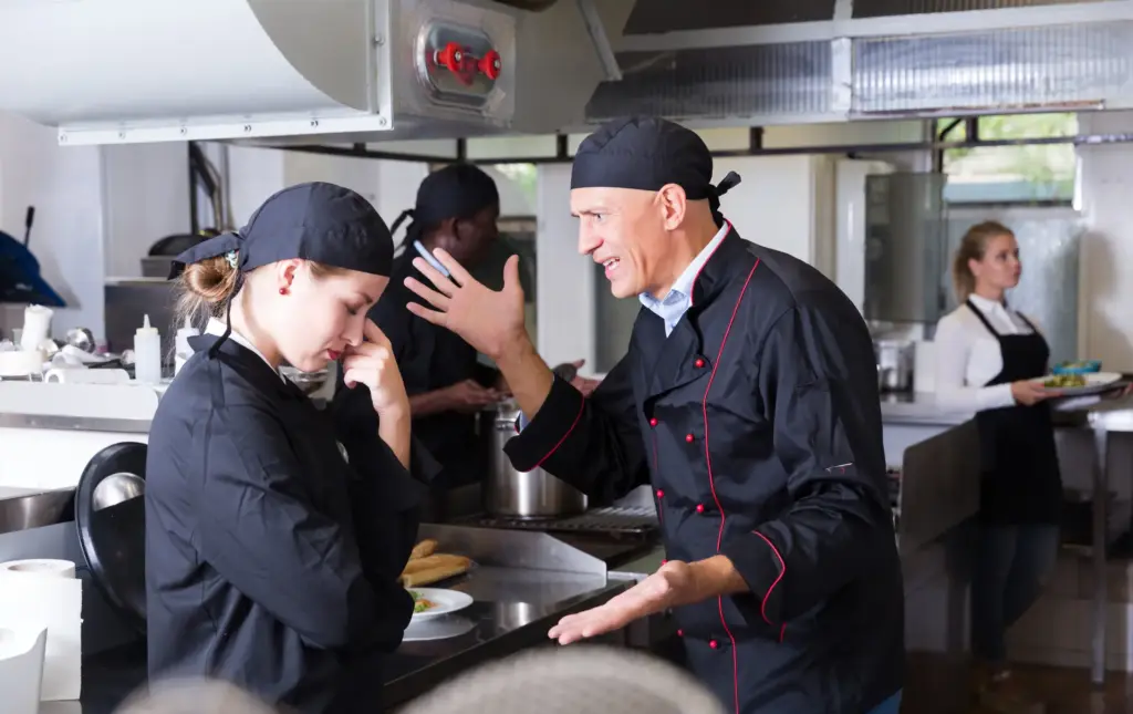 A head chef shouting at a line cook. 