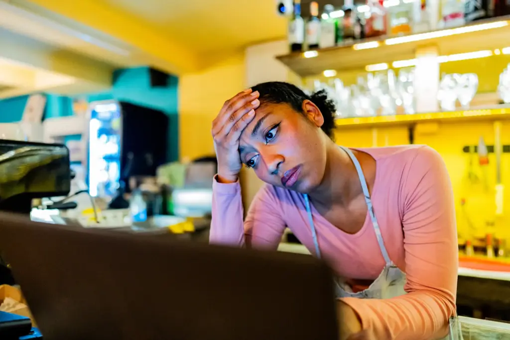 A stressed out cashier.