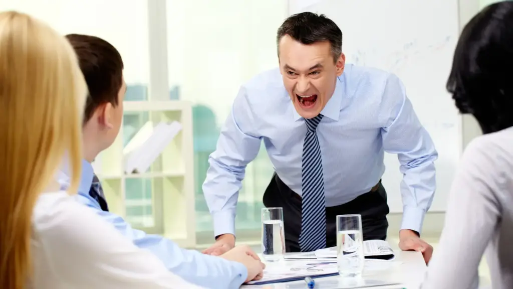 A boss shouting at his employees. 