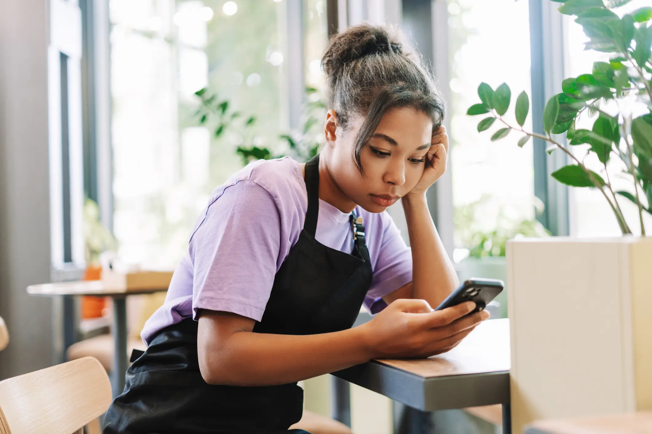 A server looking for labor lawyers on her phone.