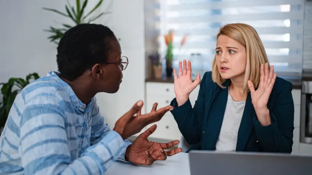 Two workers arguing with each other.