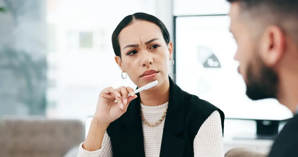 A woman interviewing someone with bias.
