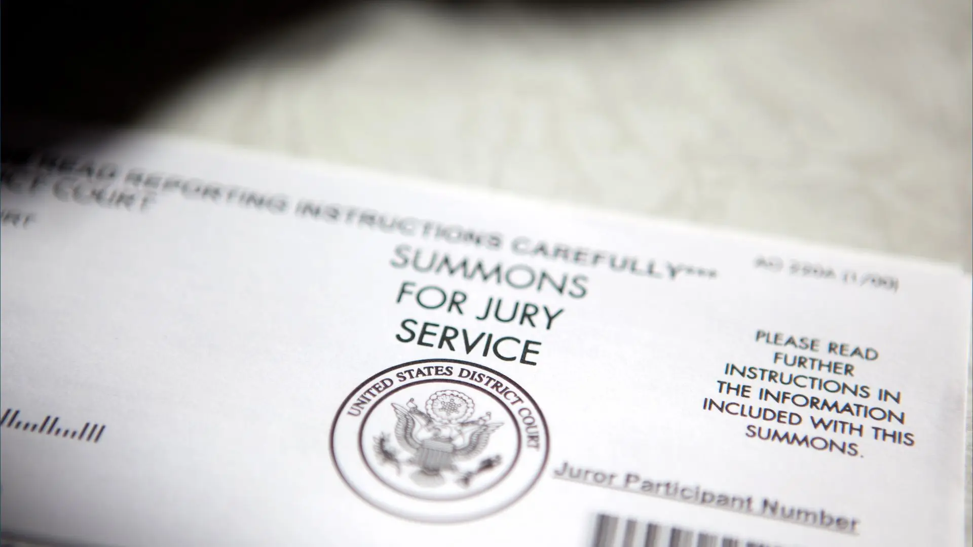 A jury summons paper.