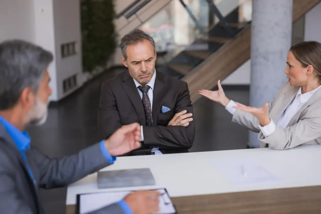 A man getting falsely accused at work.