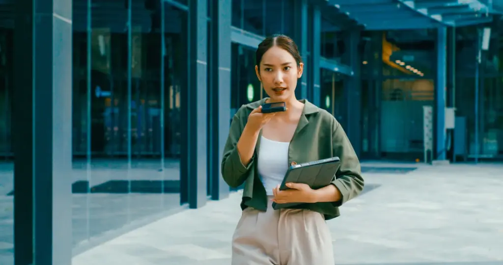 A woman making a voice memo. 