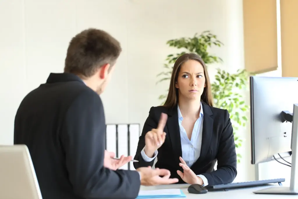An office worker and his supervisor getting into an argument about false promises.