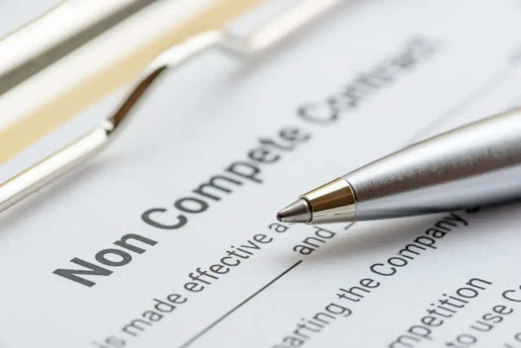 A noncompete document with a pen.
