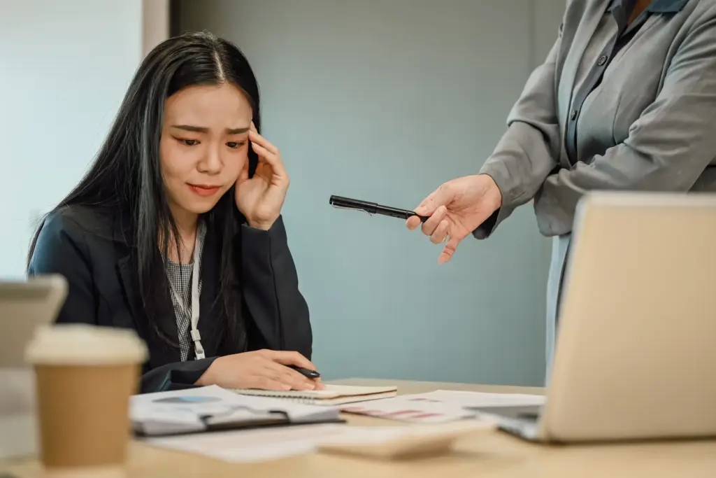 An office worker getting mistreated at work.
