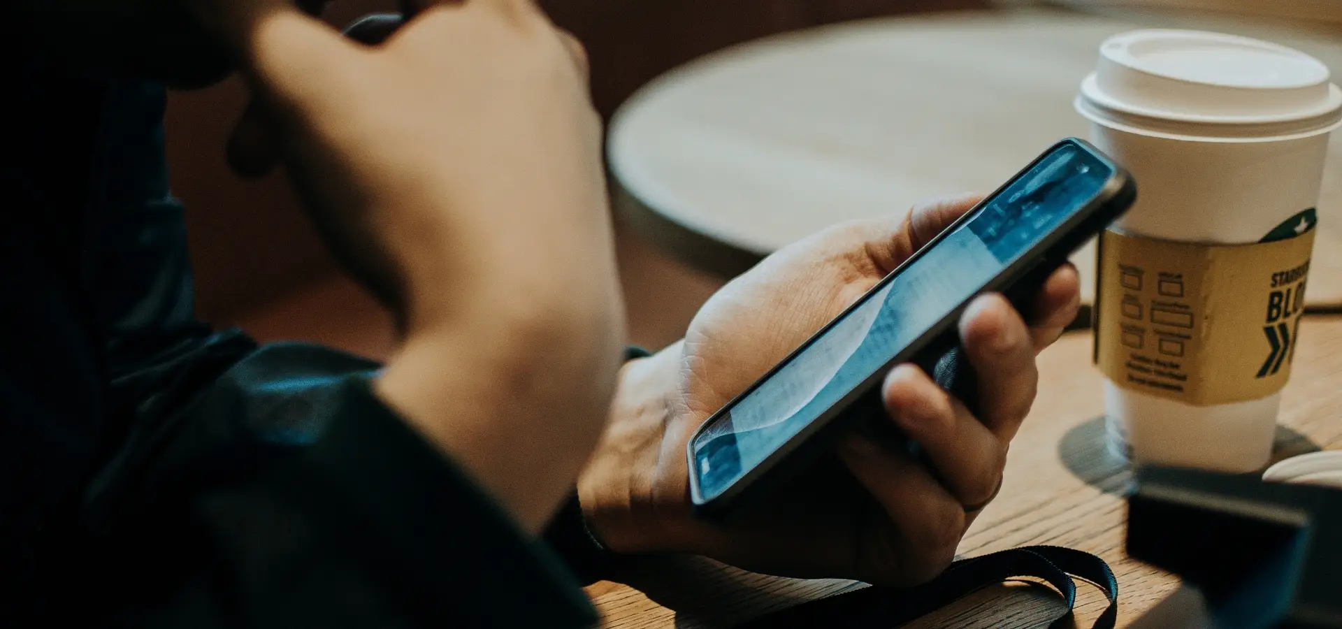 A person on their phone looking up an attorney.